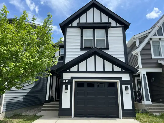 Black and white Calgary home exterior professionally painted by Dynamic Painting