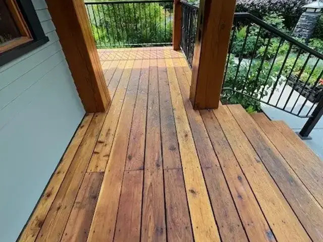 Professionally stained cedar deck and wood porch completed by Dynamic Painting in Calgary