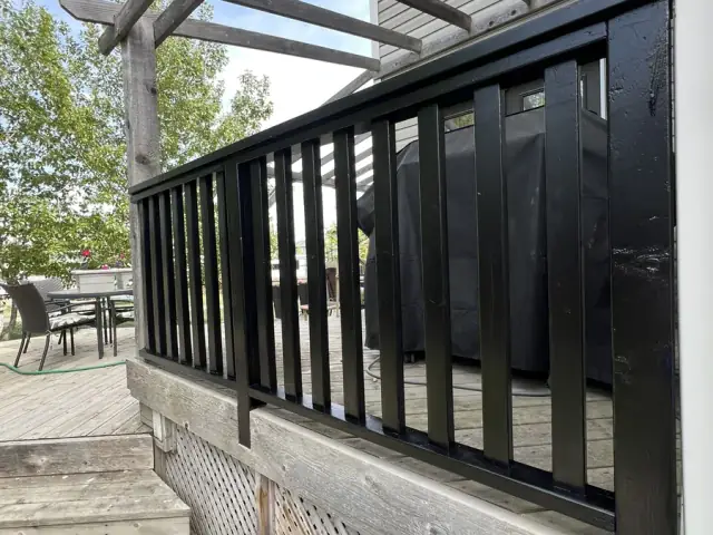 Exterior railing after dark refinishing by Dynamic Painting