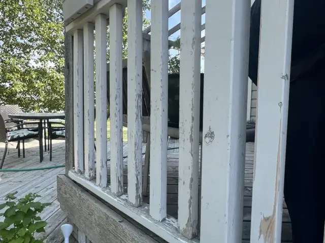 Weathered exterior railing before refinishing by Dynamic Painting