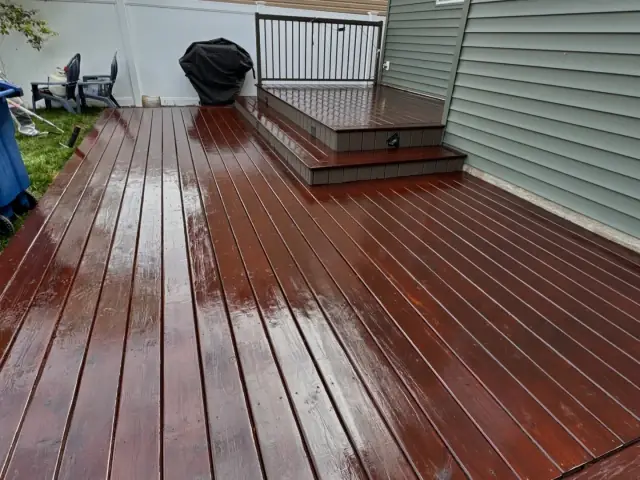 Large wood deck refinished in a rich brown exterior stain