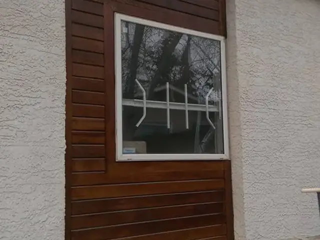Refinished cedar exterior accent surrounding a large window