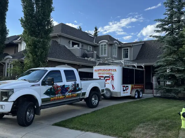 Dynamic Painting truck and trailer on site at a large completed Calgary stucco project