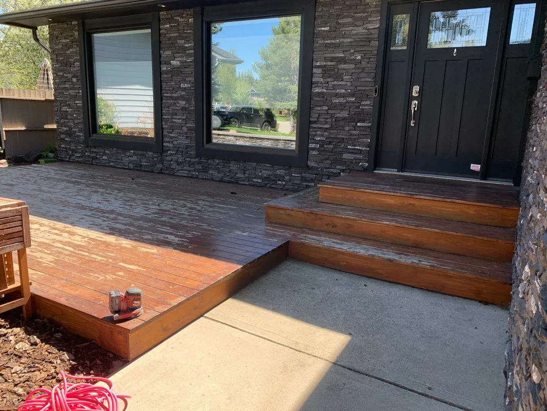 Weathered front deck before professional restoration and staining
