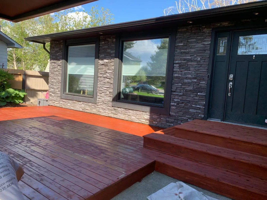 Finished front deck after professional restoration and rich wood staining