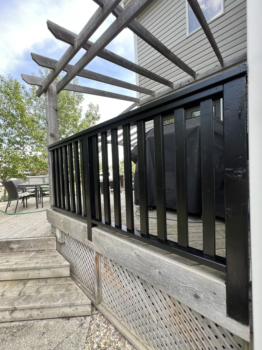 Exterior railing after dark refinishing by Dynamic Painting