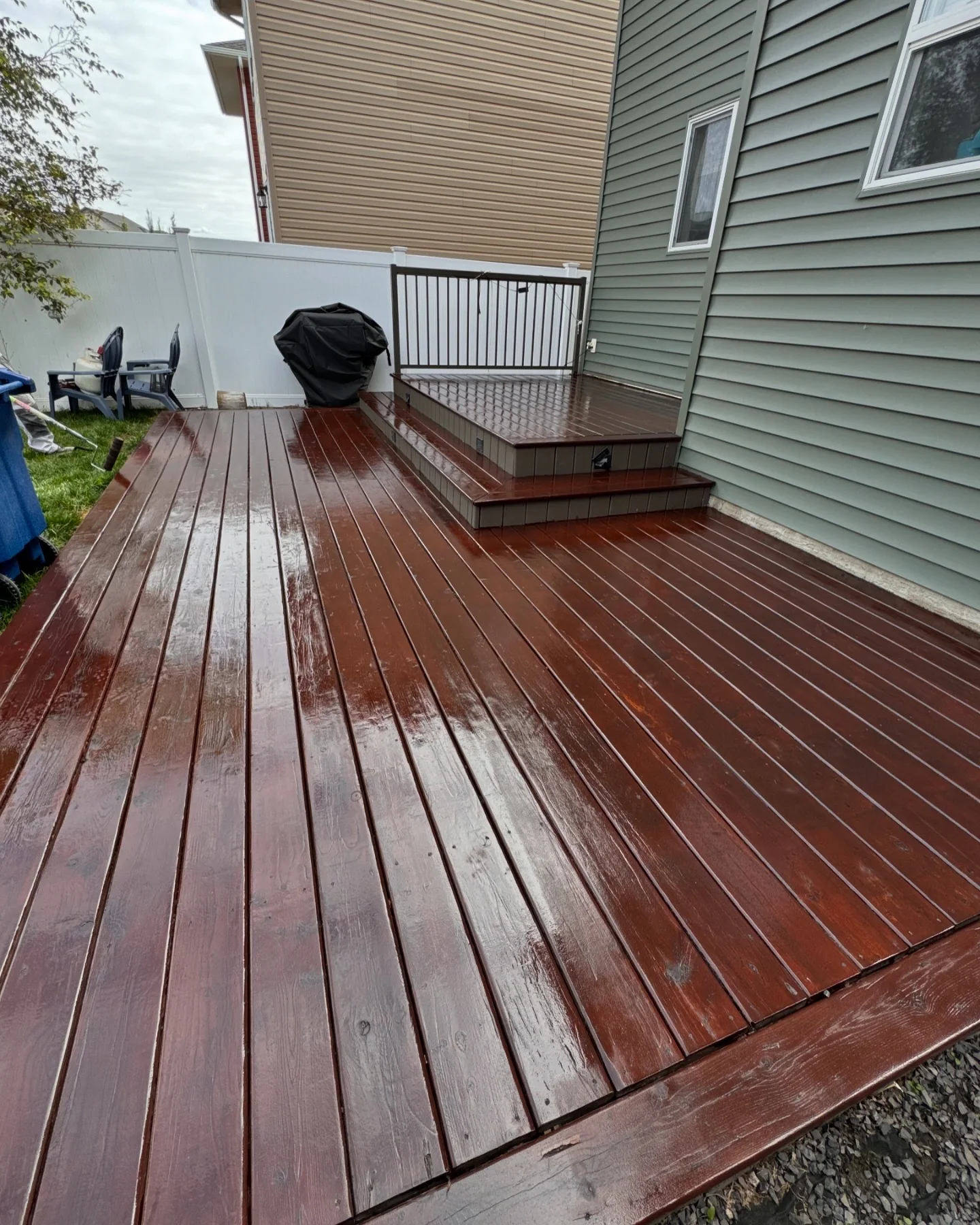 Large wood deck refinished in a rich brown exterior stain