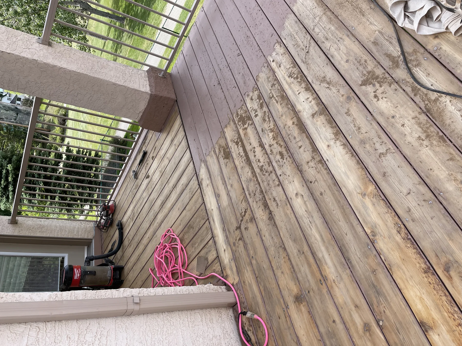 Wood deck stripped and sanded during preparation for refinishing