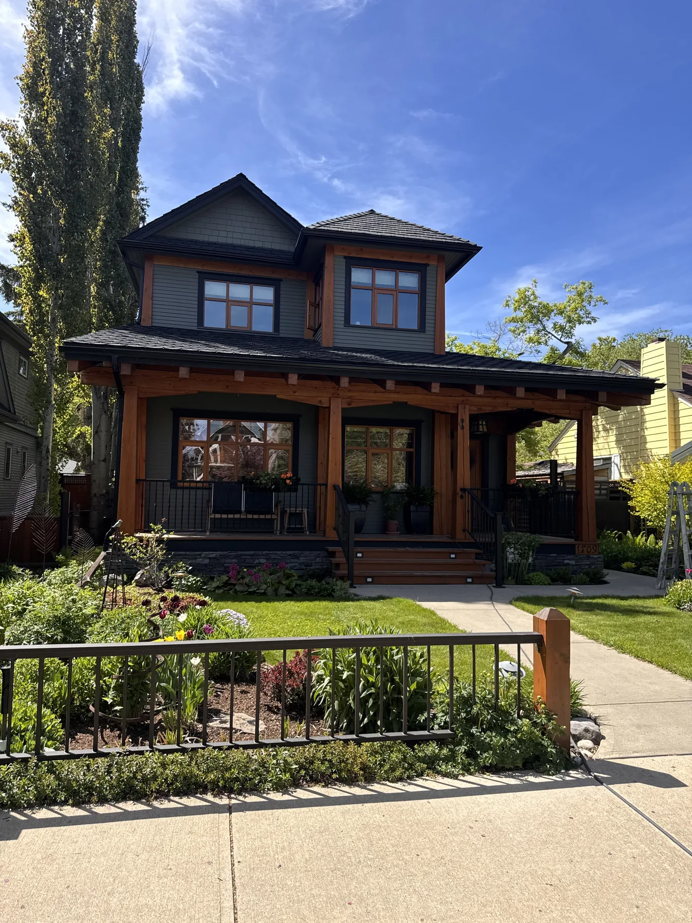 Completed dark exterior painting project on a character home by Dynamic Painting