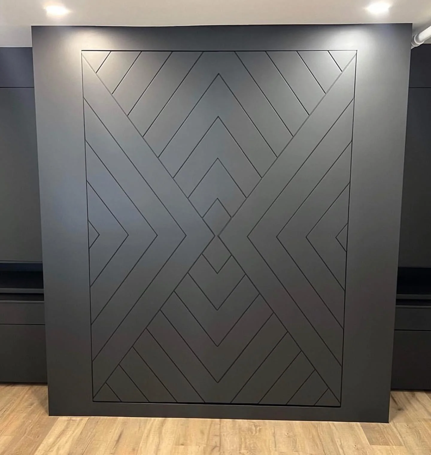 Geometric painted feature wall completed by Dynamic Painting in a Calgary interior