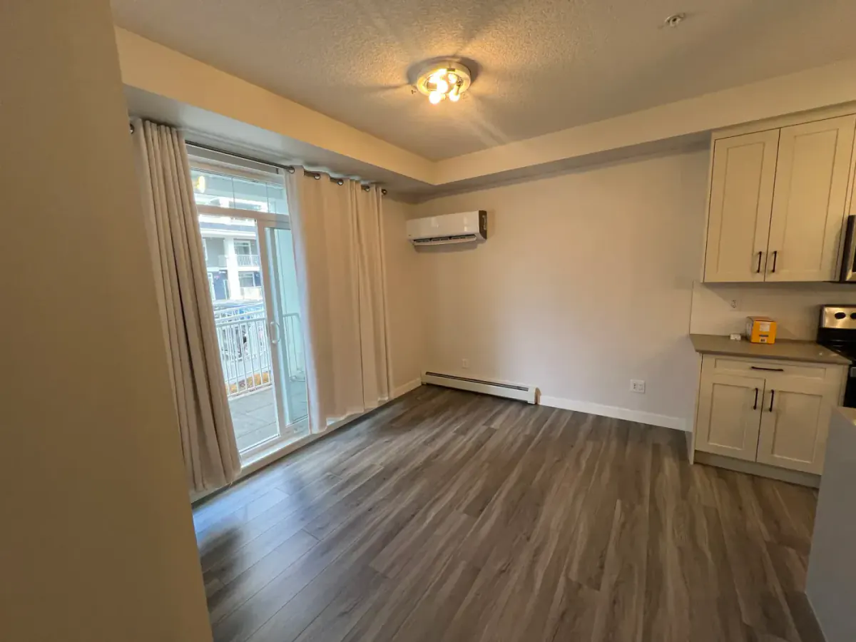 Modern Calgary condo dining area with clean neutral walls and bright white trim