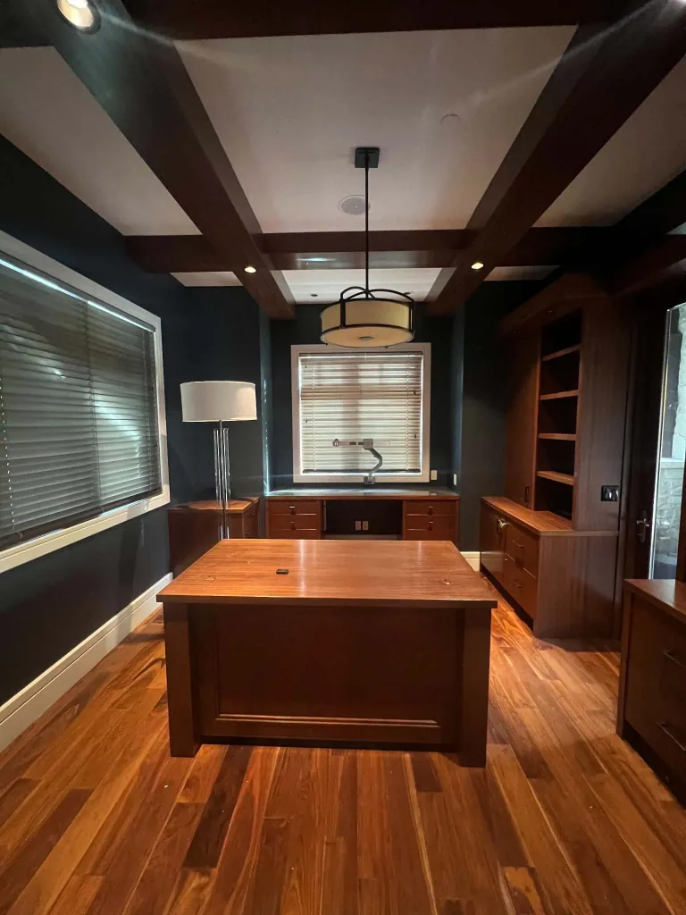 Completed Hale Navy office walls around retained wood beams, cabinetry and a wood desk