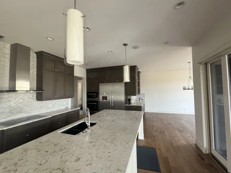 Finished wall painting in the kitchen of the same Calgary open-concept home