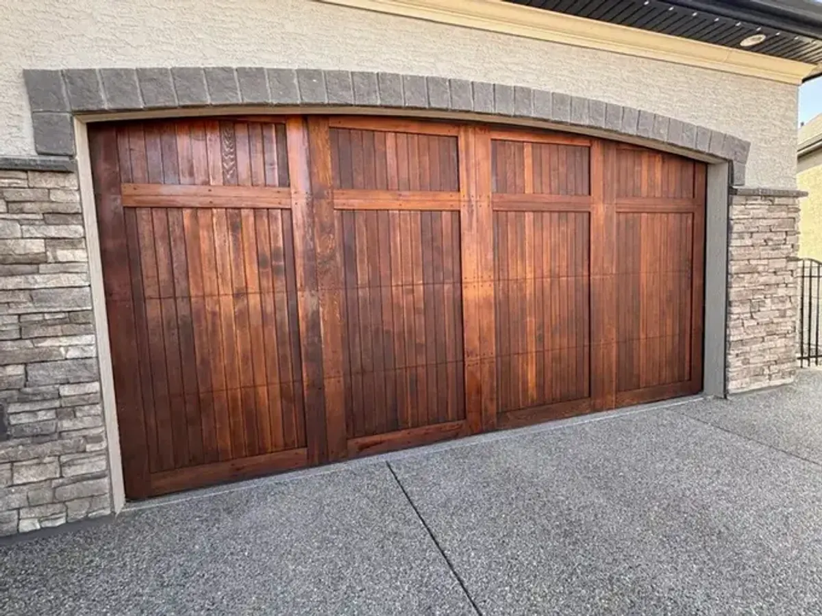 A wood garage door after refinishing by Dynamic Painting