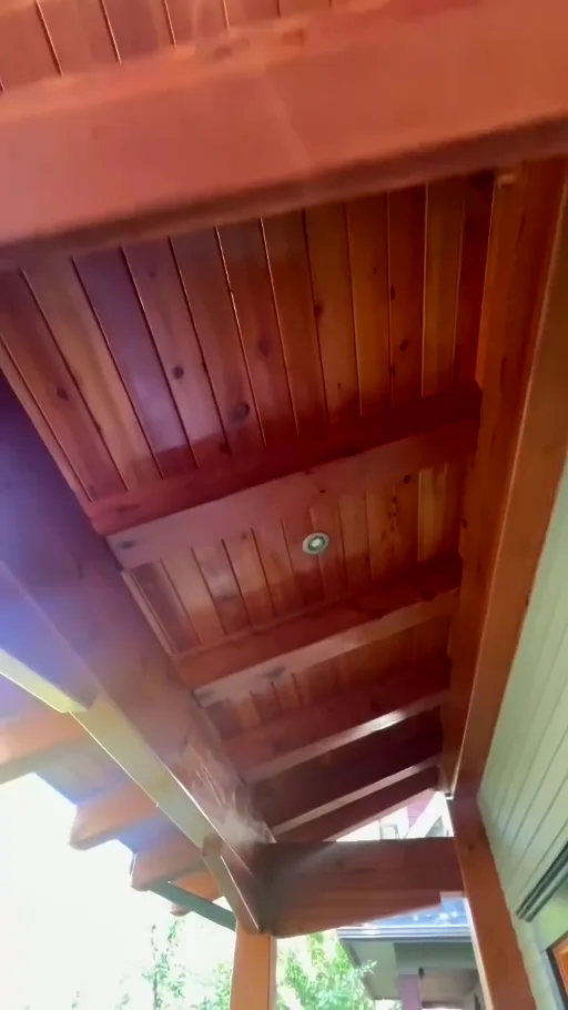 Refreshed exterior wood soffits and beams after Dynamic Painting's linseed-oil maintenance